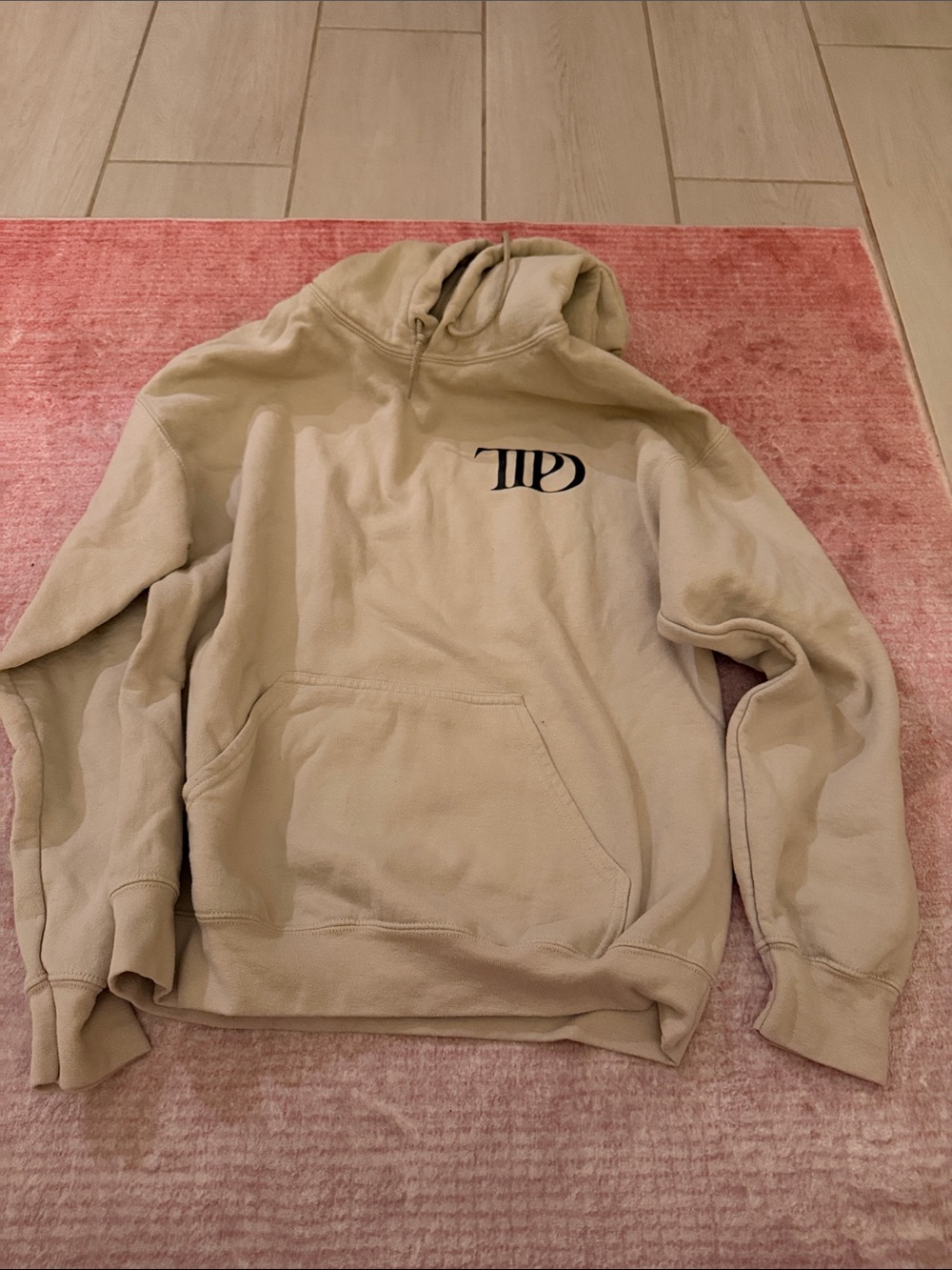 Taylor Swift TTPD Beige Pullover Hoodie with Black Chest Logo